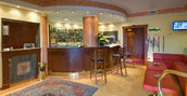 Reception accogliente dell’As Hotel per soggiorni brevi a Monza